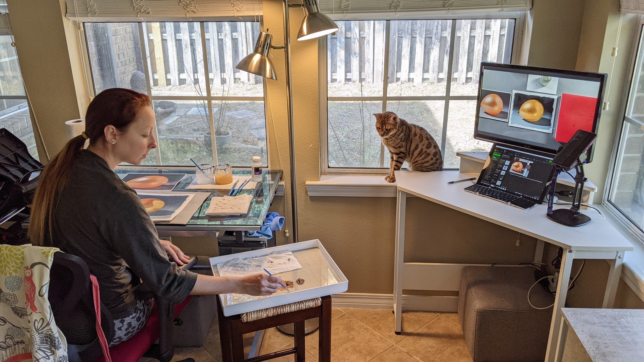 me painting in my studio with my cat sushi watching over me